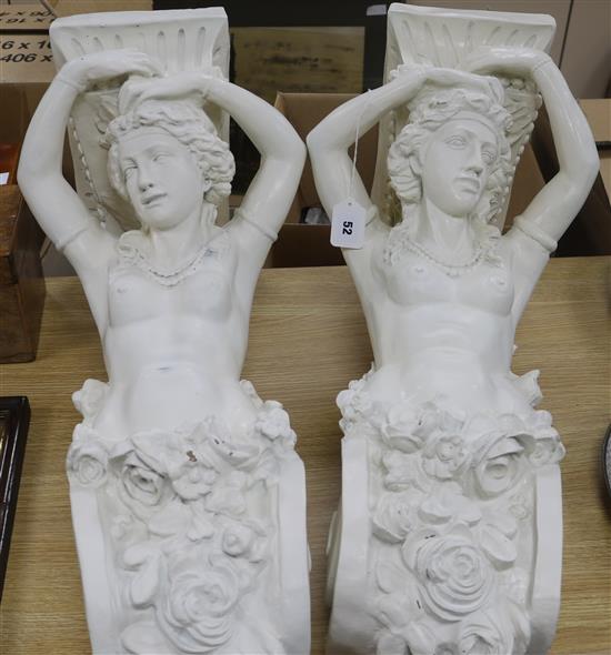 A pair of figural wall brackets length 72cm